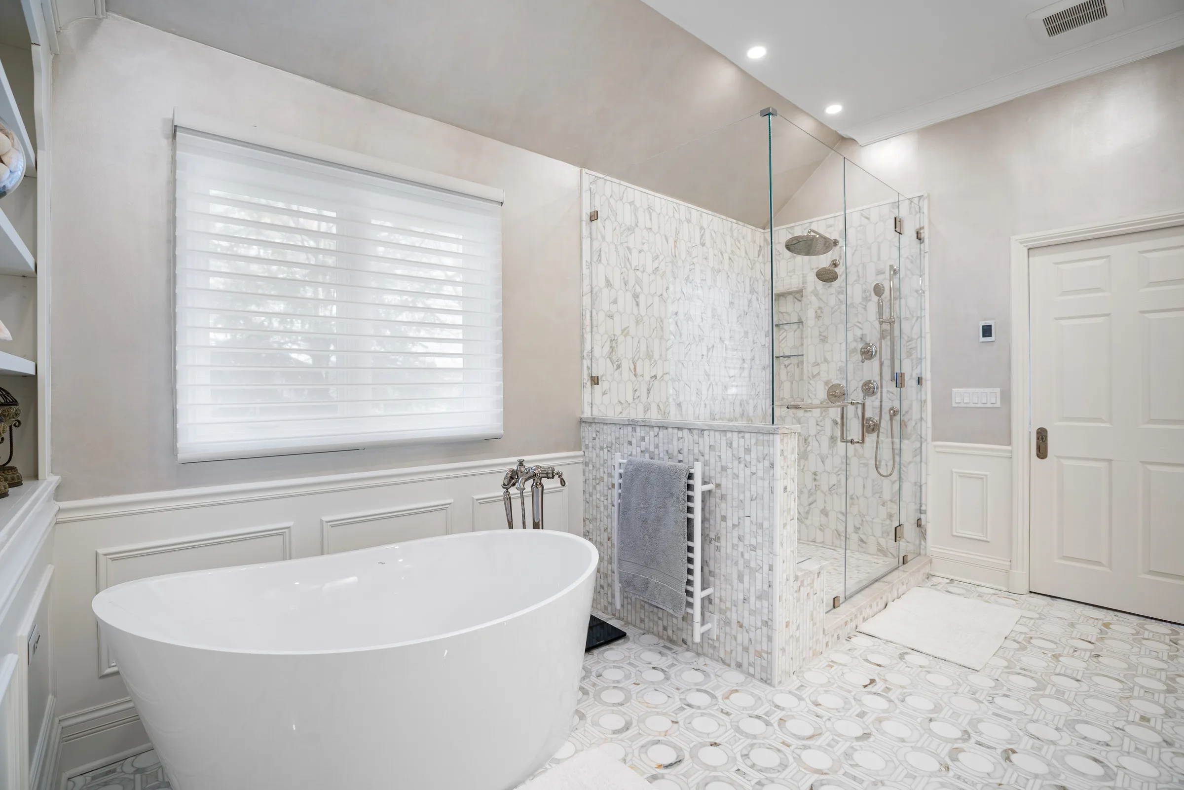 Spa bathroom with freestanding tub and custom tile shower