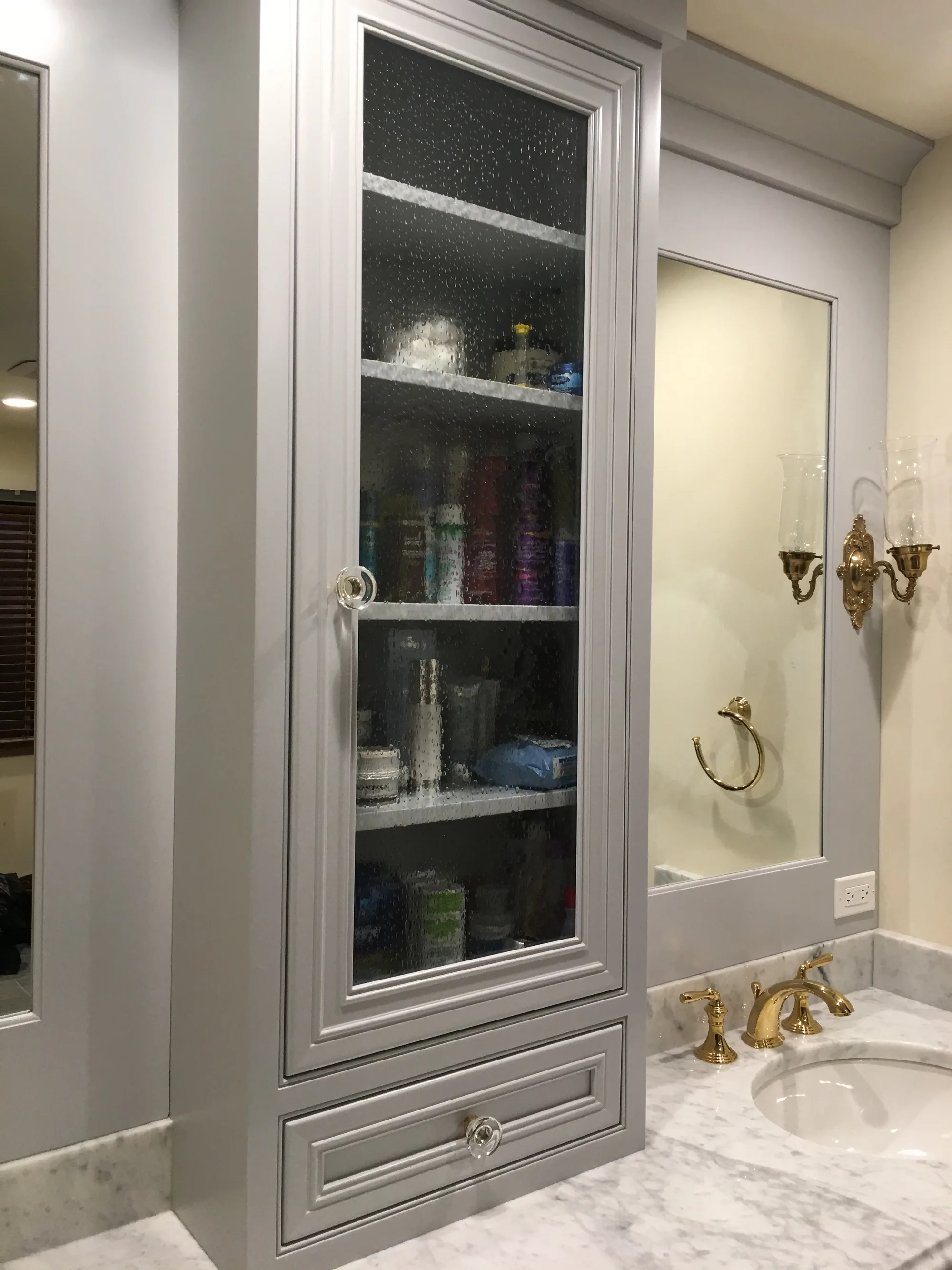 Lake Forest bathroom: frameless glass walk-in shower adjacent to gray vanity