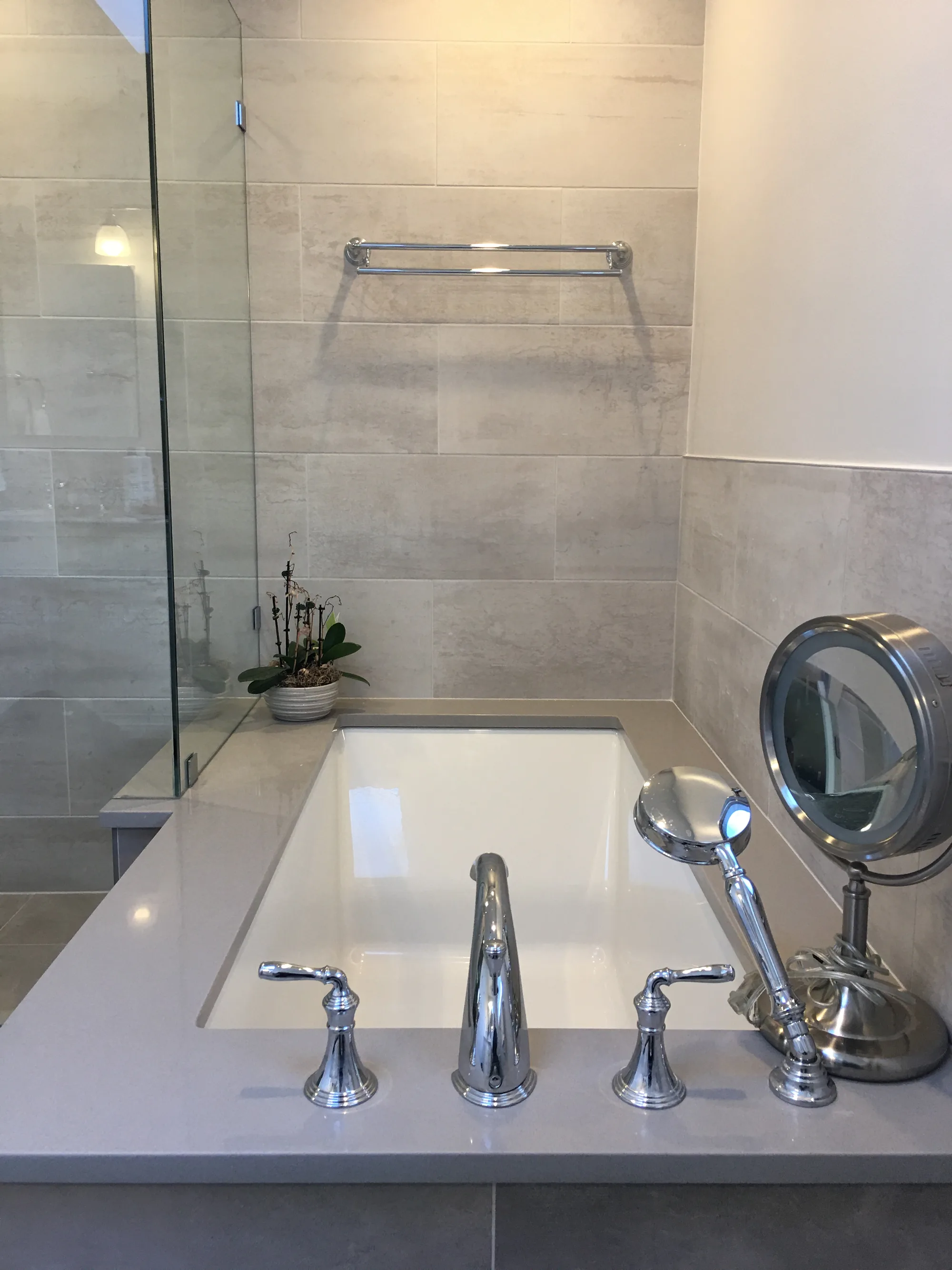 Lake Forest bathroom: drop-in tub with chrome widespread filler beside frameless glass shower