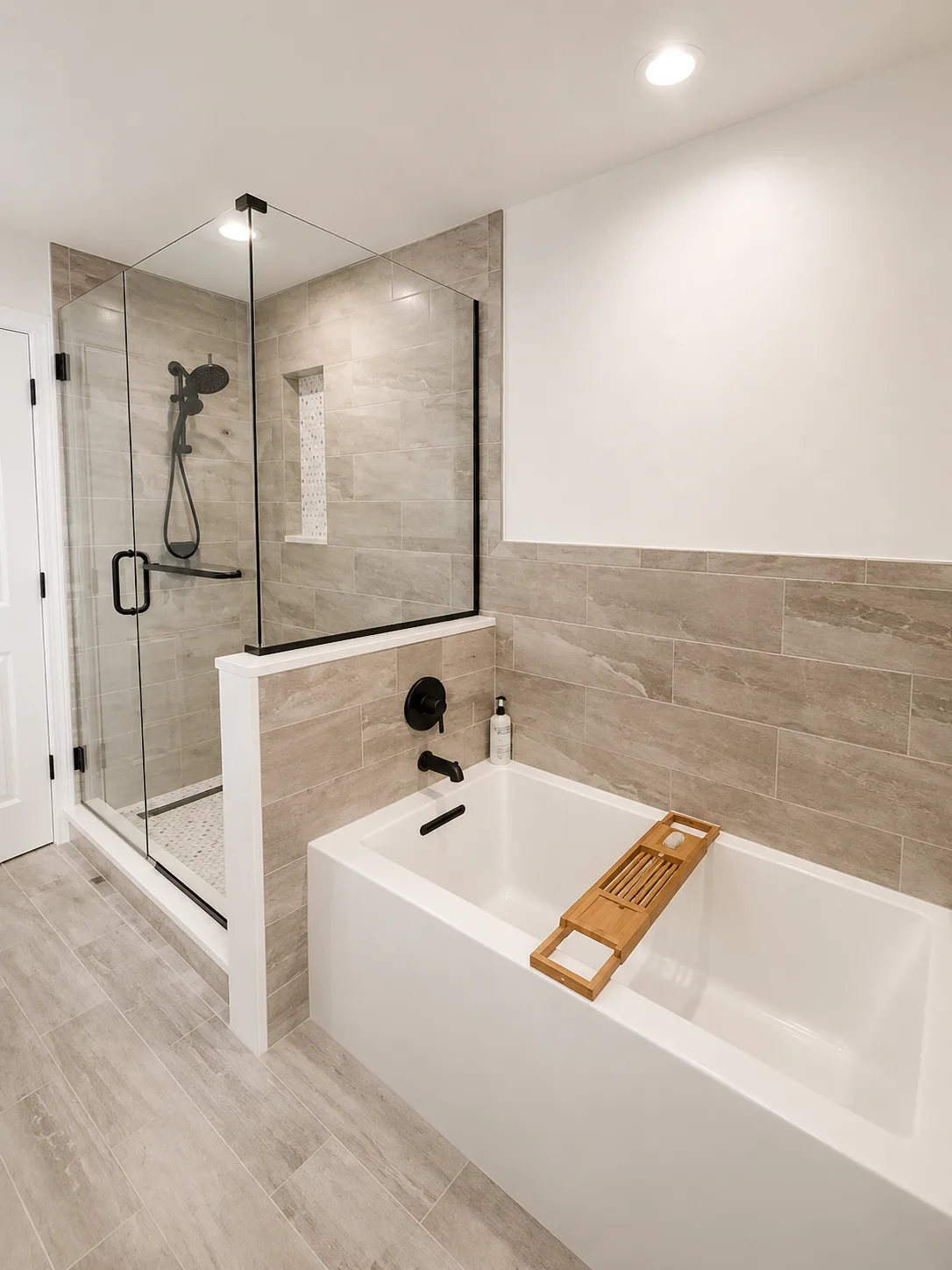 Walk-in glass shower and alcove soaking tub in the completed Highland Park bathroom remodel