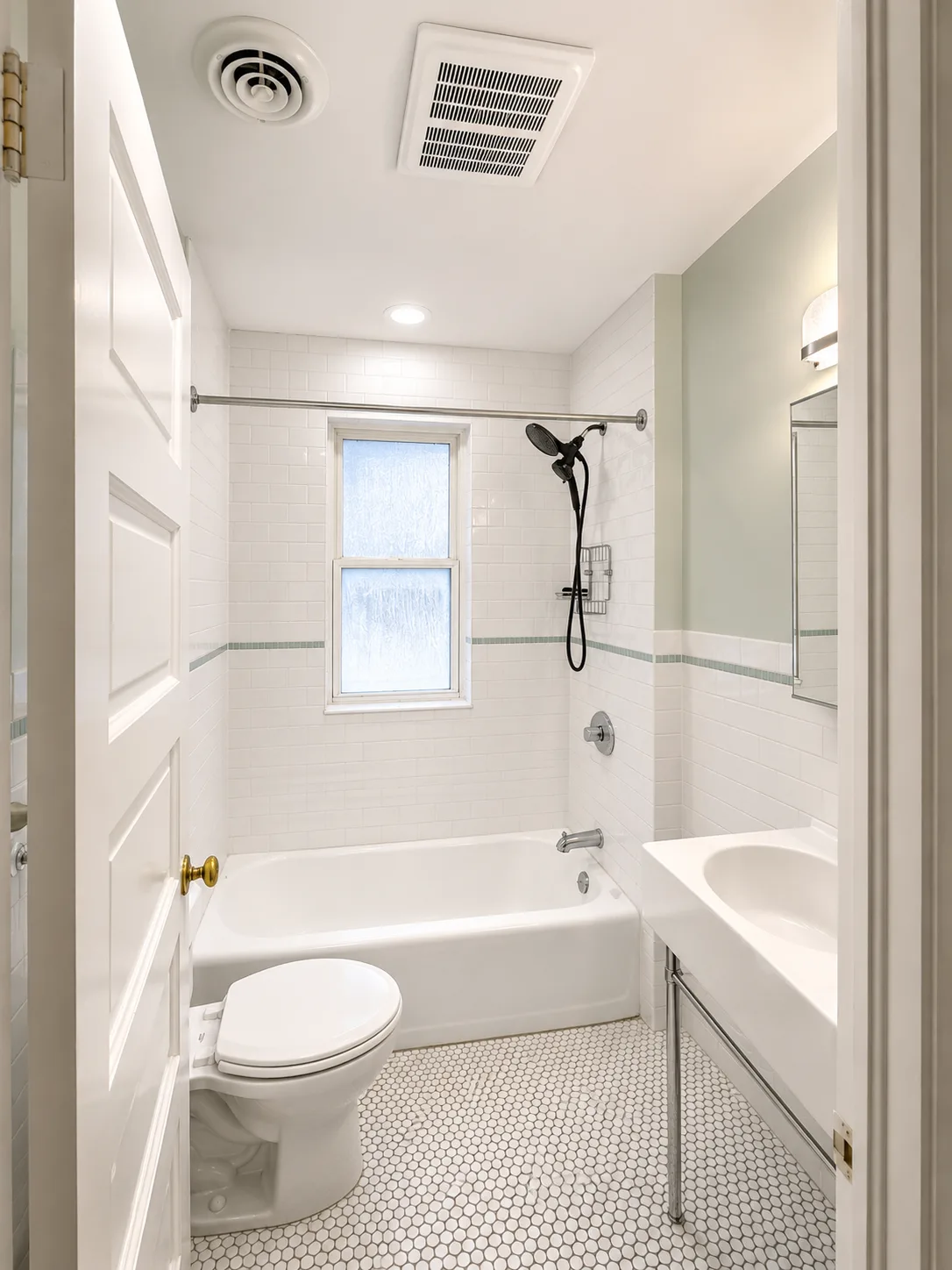 Completed highland park blue tile bathroom remodel by Delta Remodels