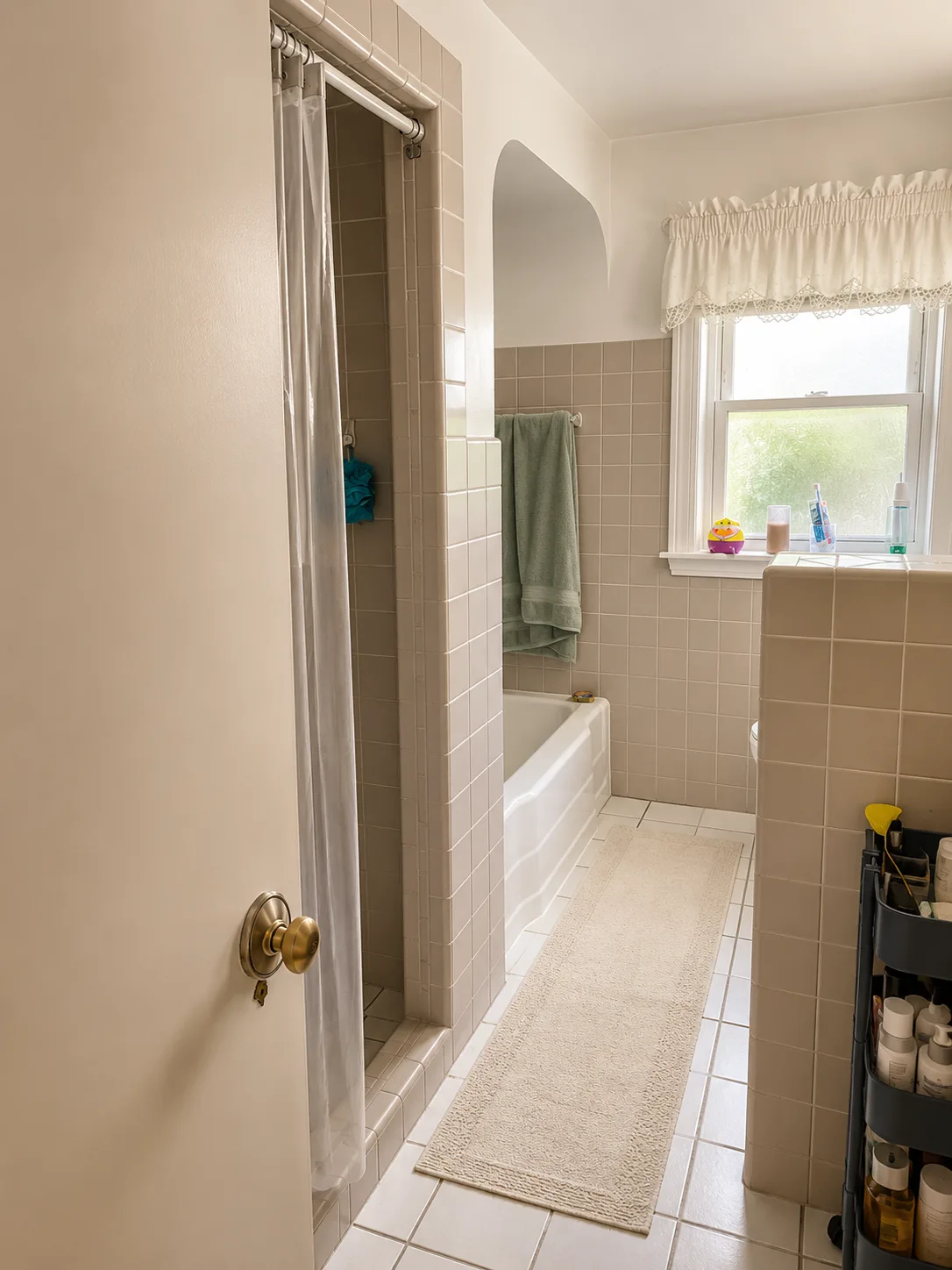 Highland Park Condo Bathroom Remodel with Blue Accent Tile and Penny Tile Floor before remodeling