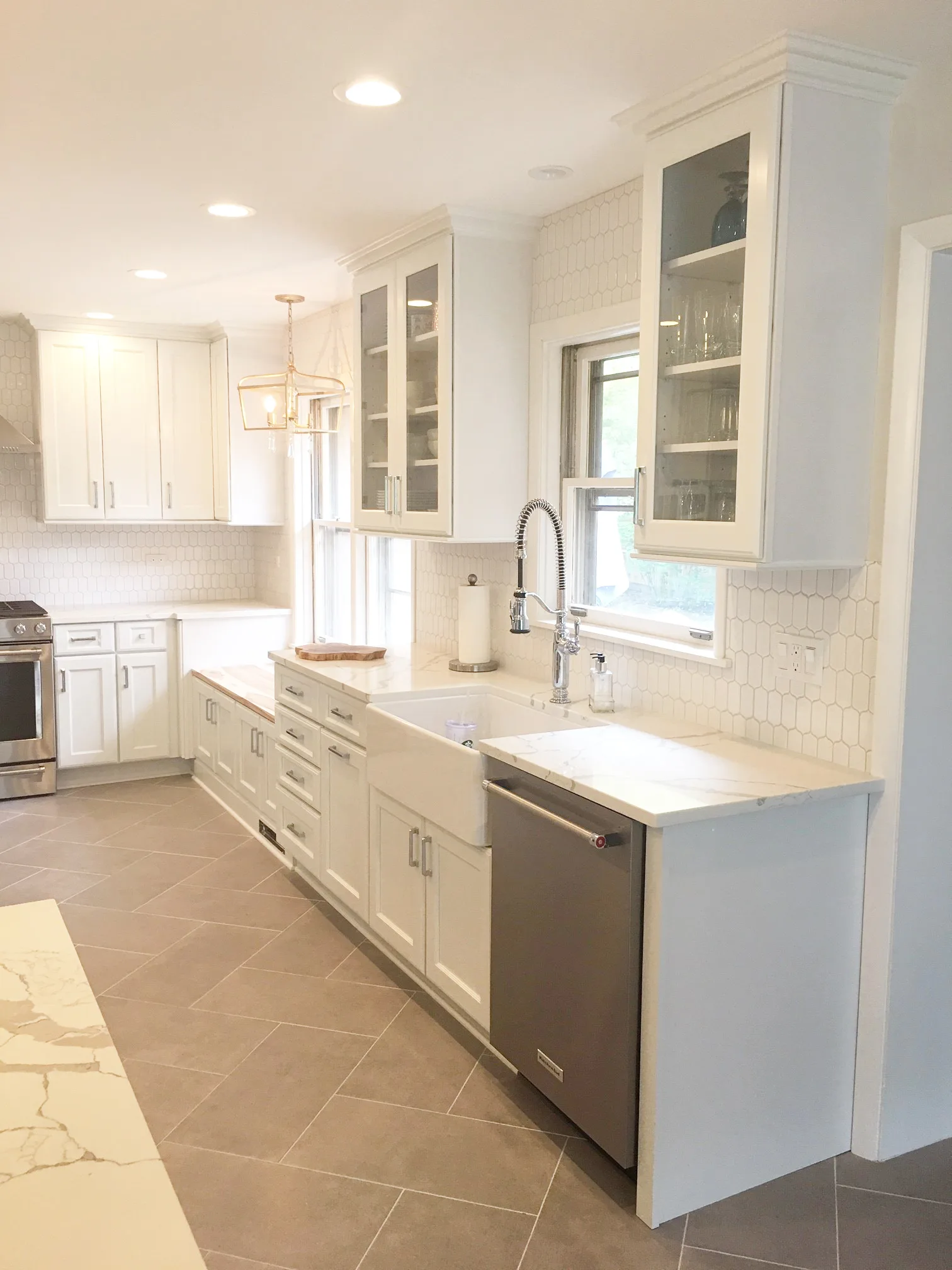 Lake Bluff kitchen: gray porcelain plank floor in herringbone layout