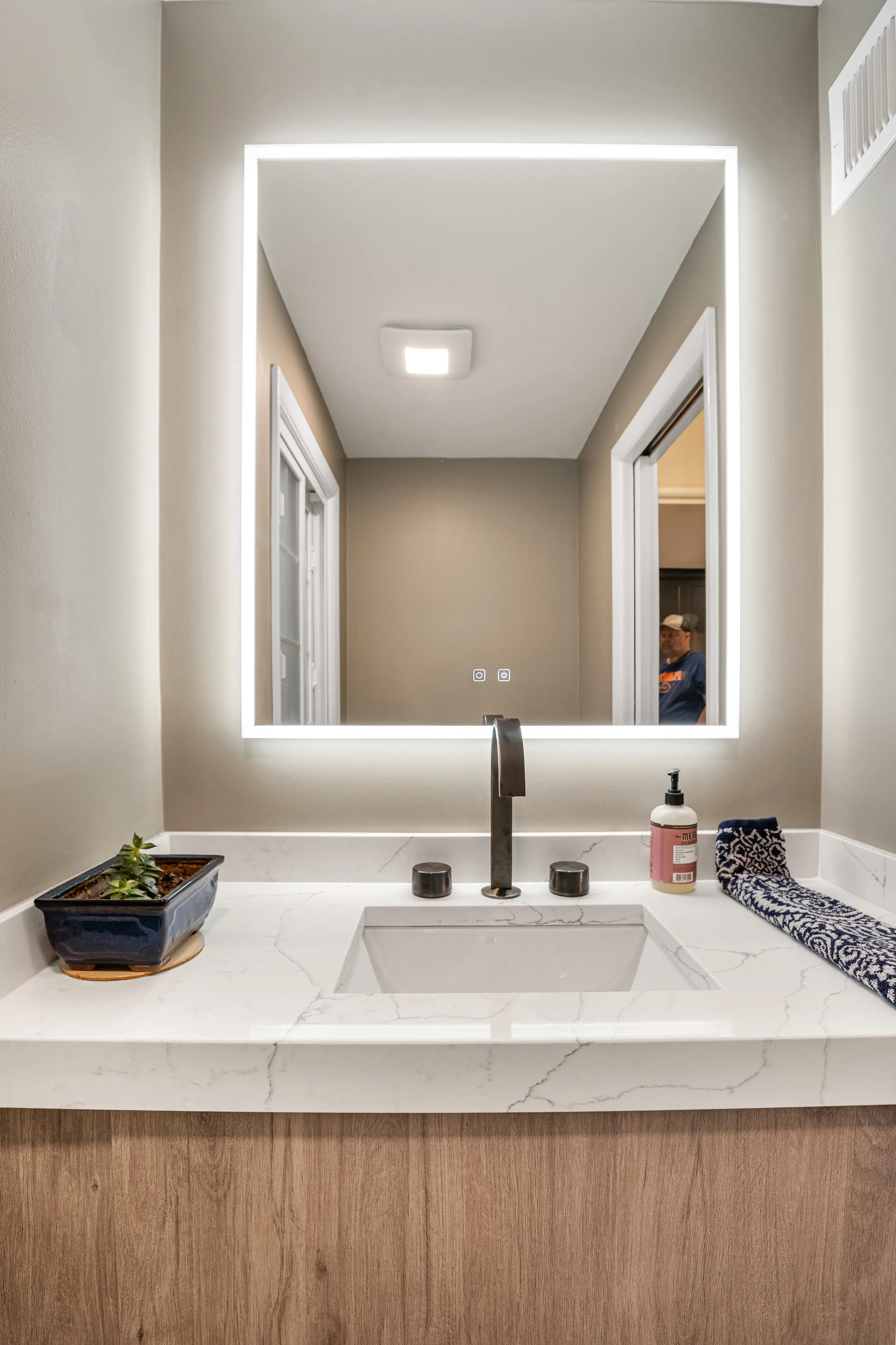 Lake Forest powder room remodel: matte black faucet close-up