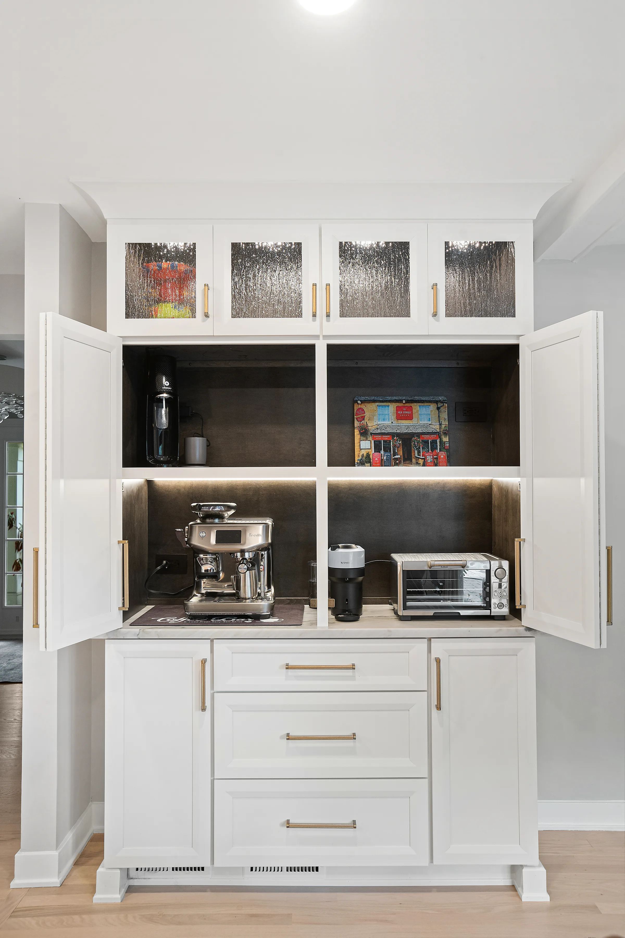 Glenview kitchen remodel: espresso-toned bar with glass-front uppers and marble counter