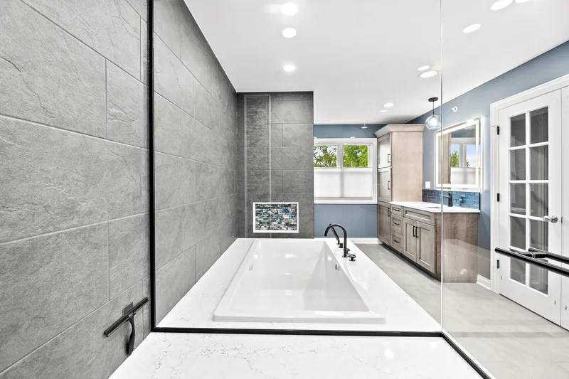 Mount Prospect spa bathroom with slate tile and drop-in tub
