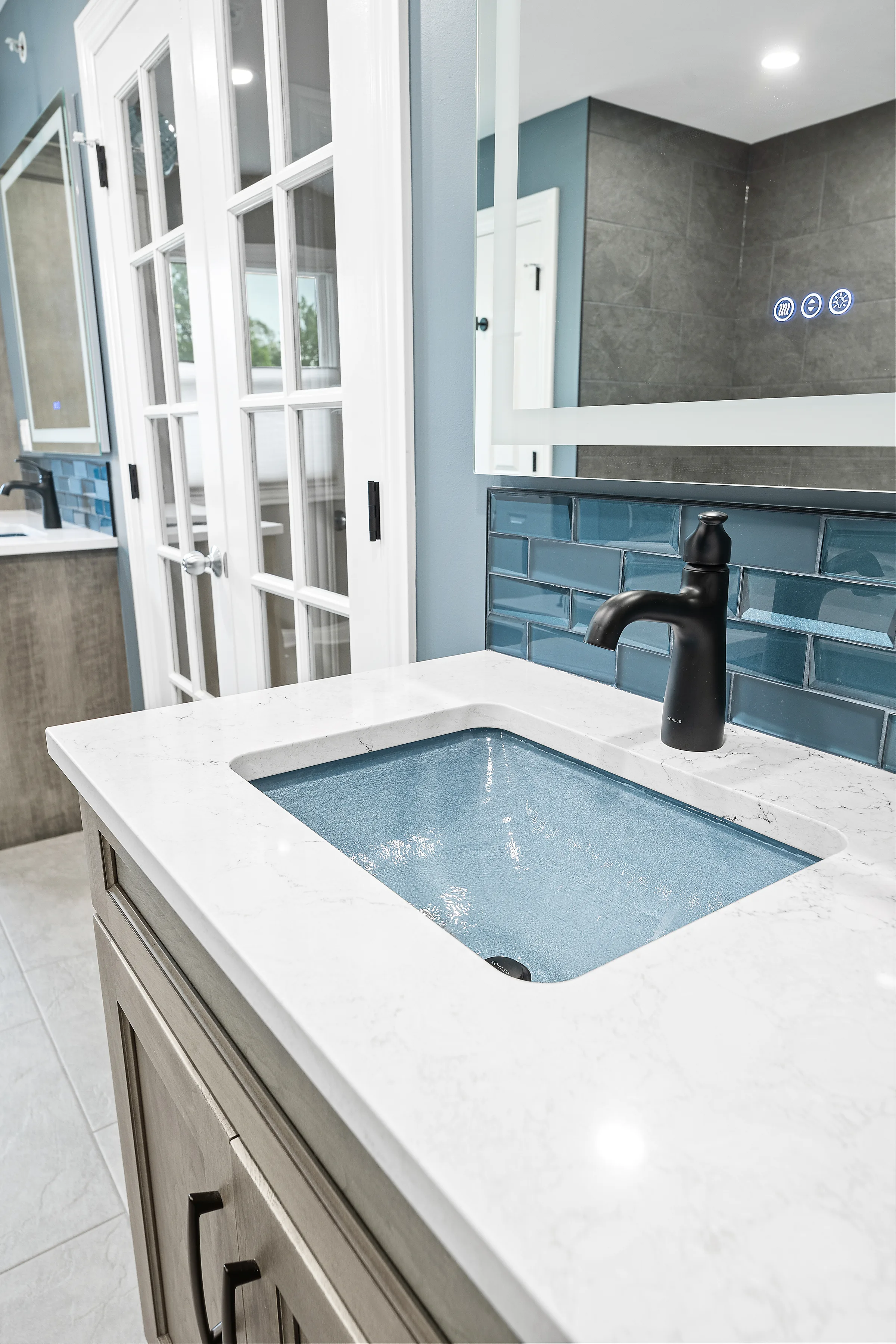 Mount Prospect spa bathroom: tub filler and mosaic niche close-up