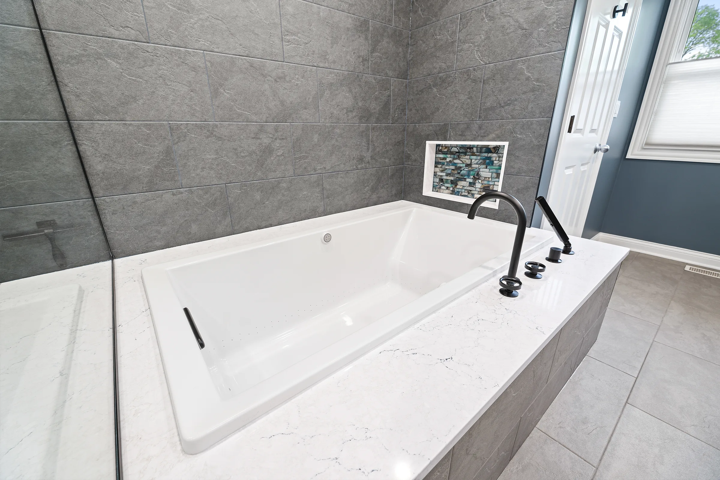 Mount Prospect spa bathroom: wood vanity with quartz counter