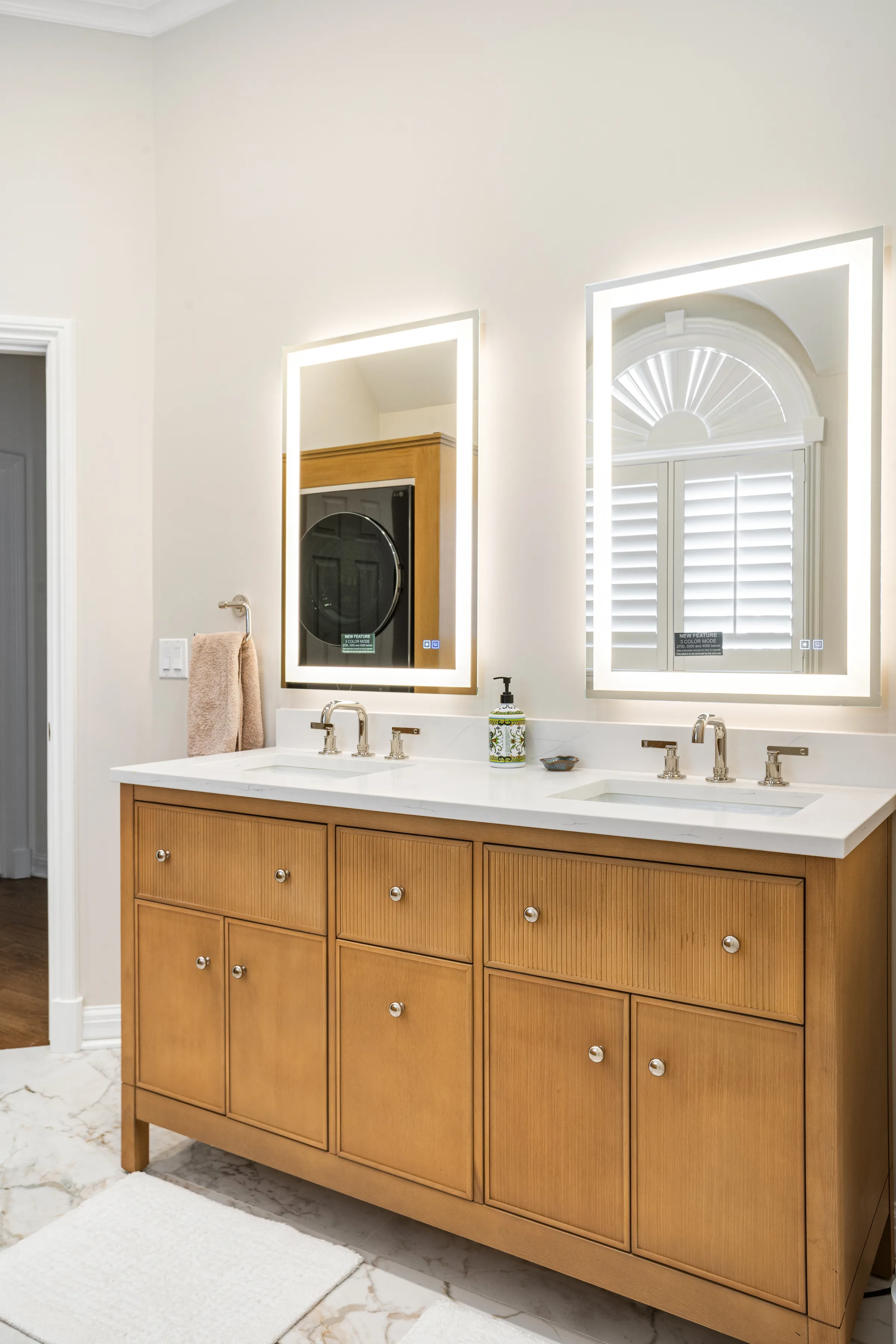 Lake Forest bathroom remodel: laundry and mudroom area with stacked washer dryer