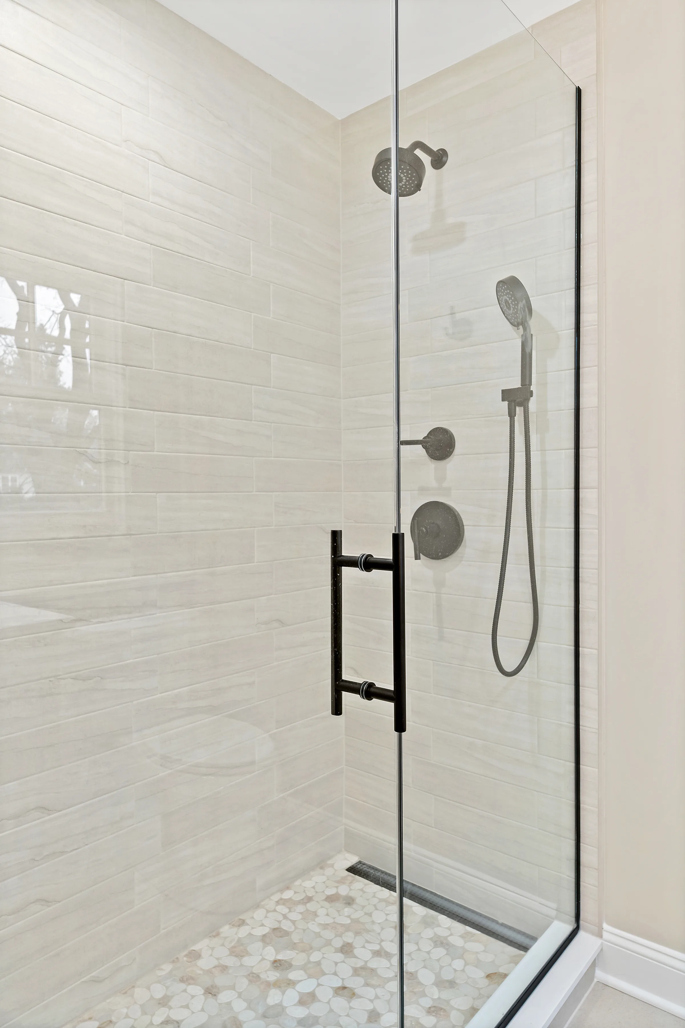 Northbrook bathroom remodel: wide view of vanity and shower wall