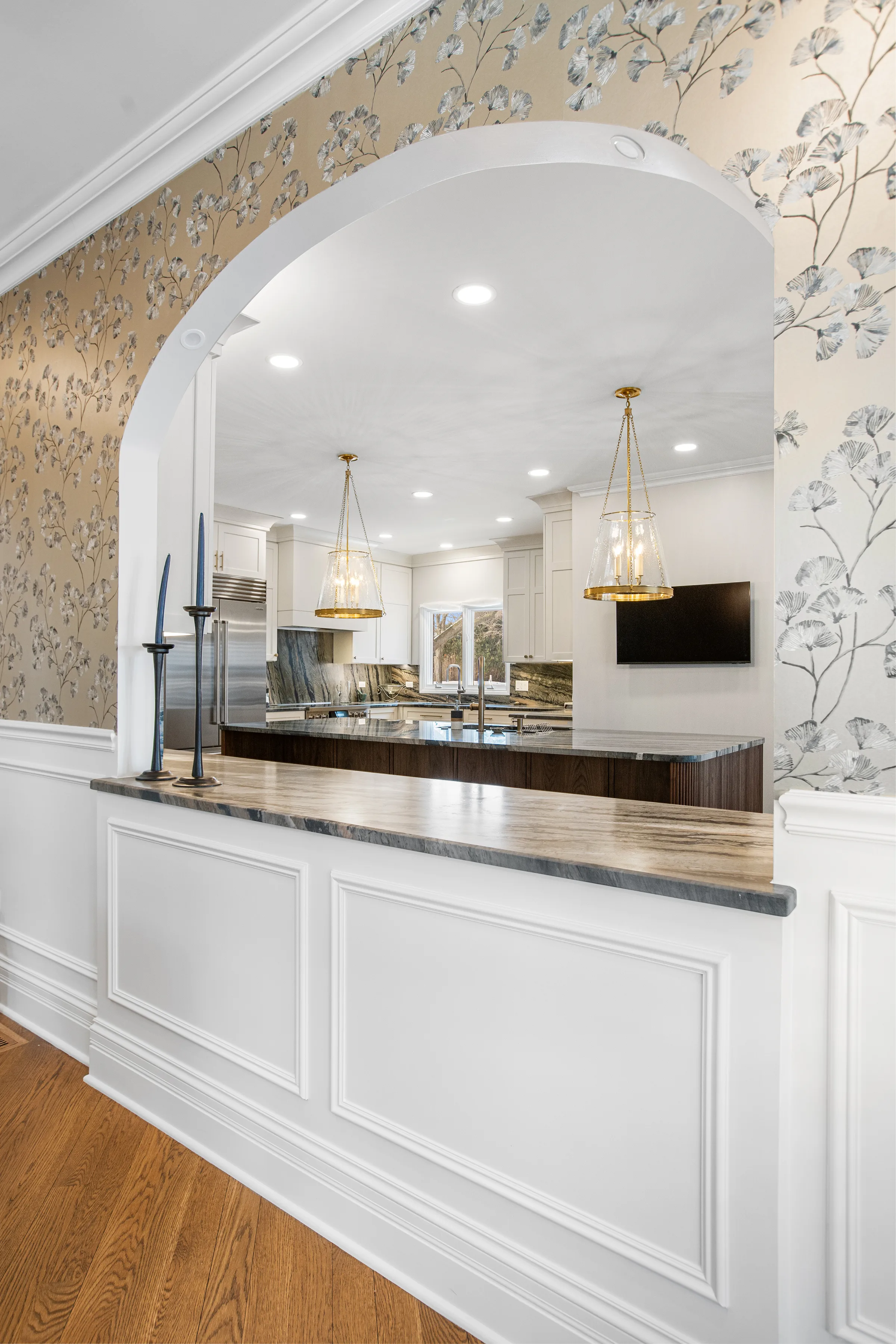 Lake Forest butler’s pantry: walnut fluted back panel with glass-front uppers