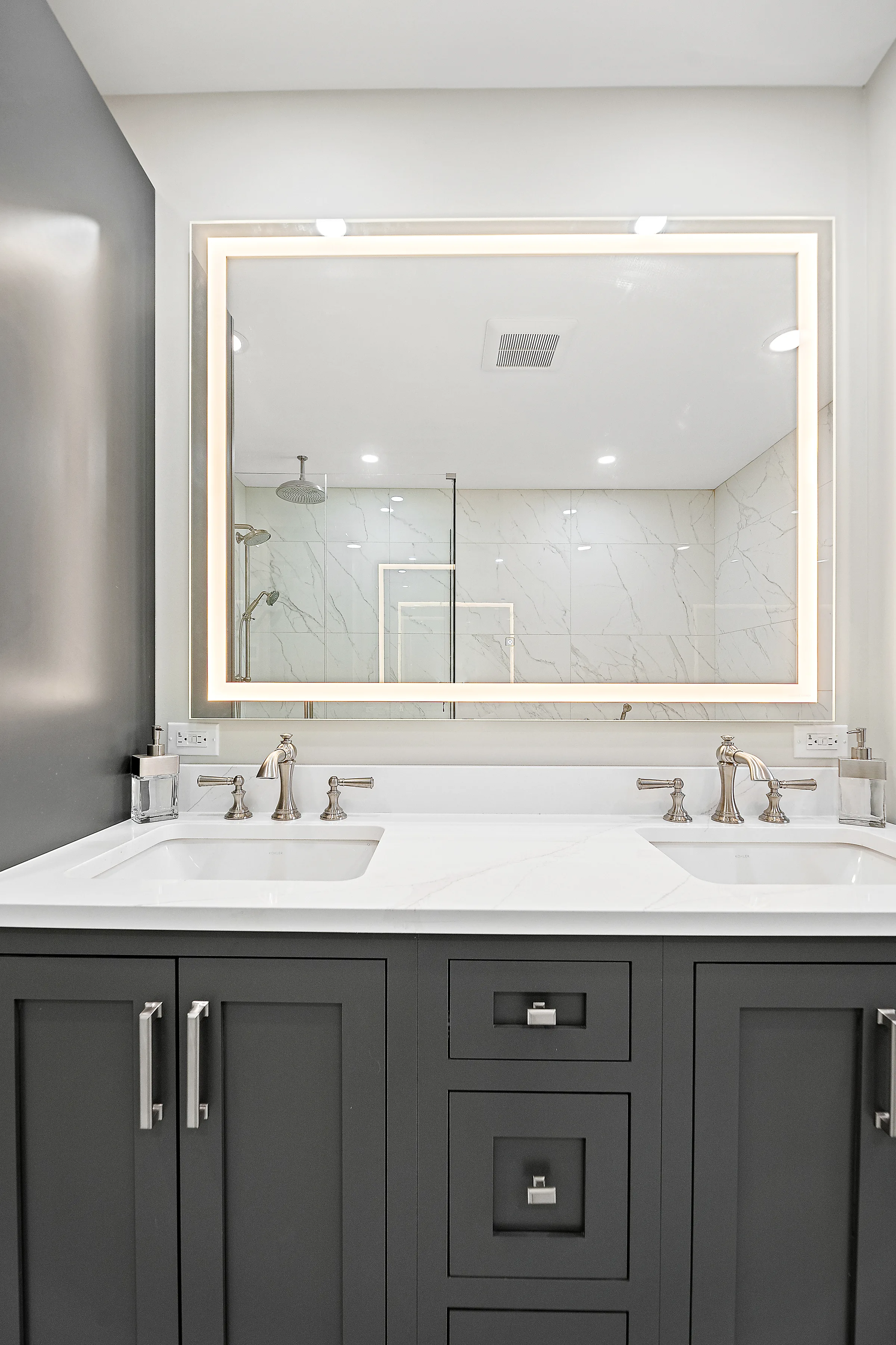 Lake Bluff bathroom remodel: double vanity with quartz counter and polished nickel fixtures