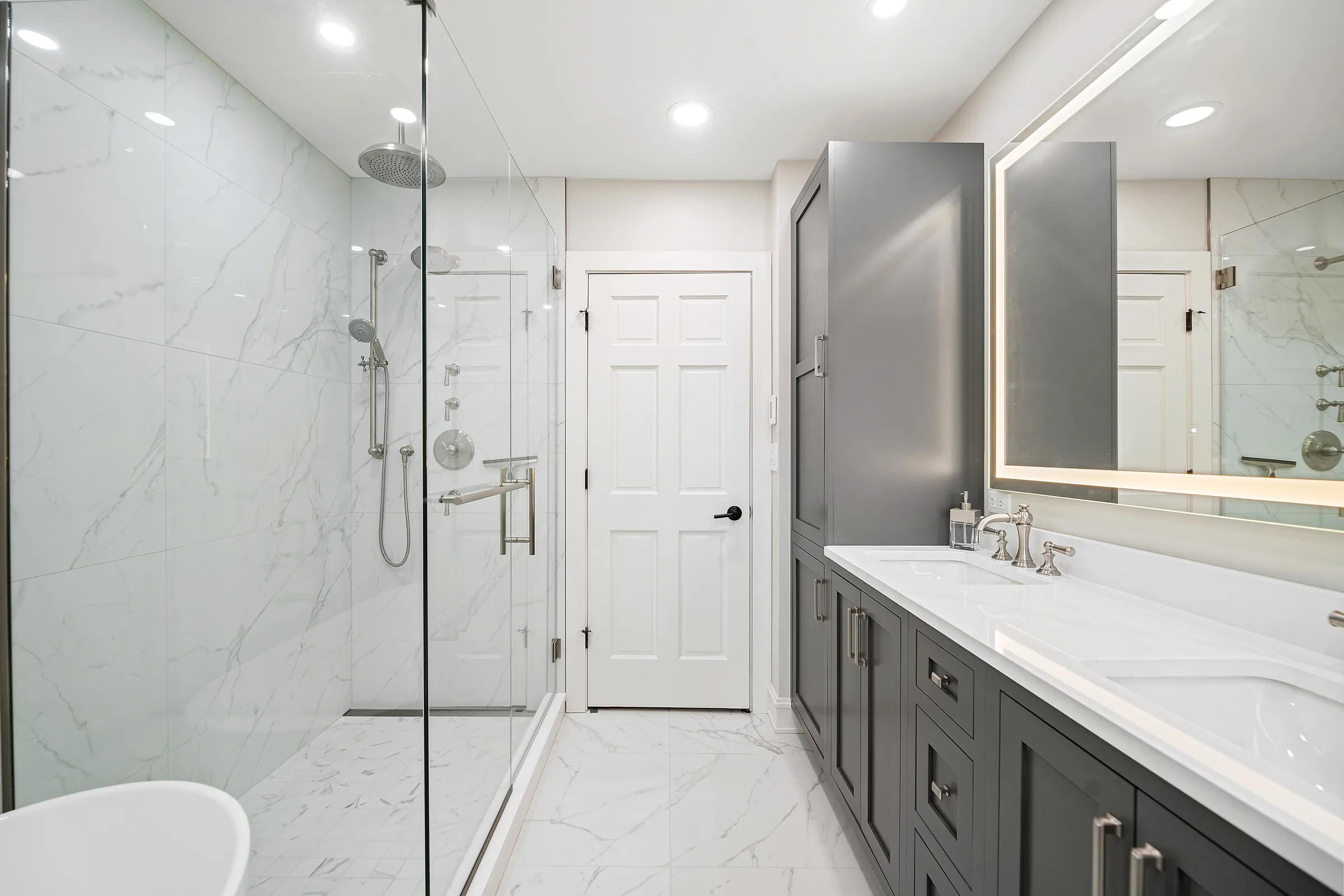Lake Bluff bathroom remodel: marble-look porcelain wall tile detail