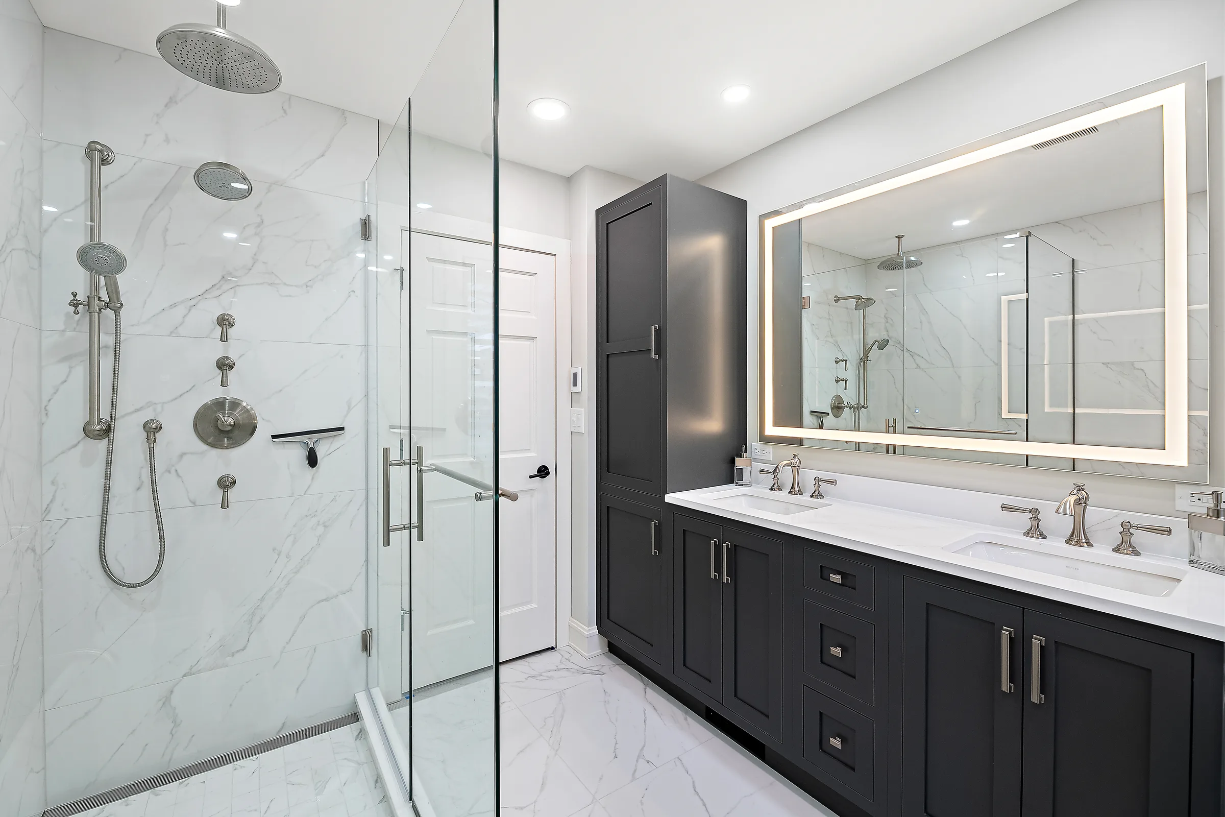 Lake Bluff primary bathroom by Delta Remodels: finished interior overview