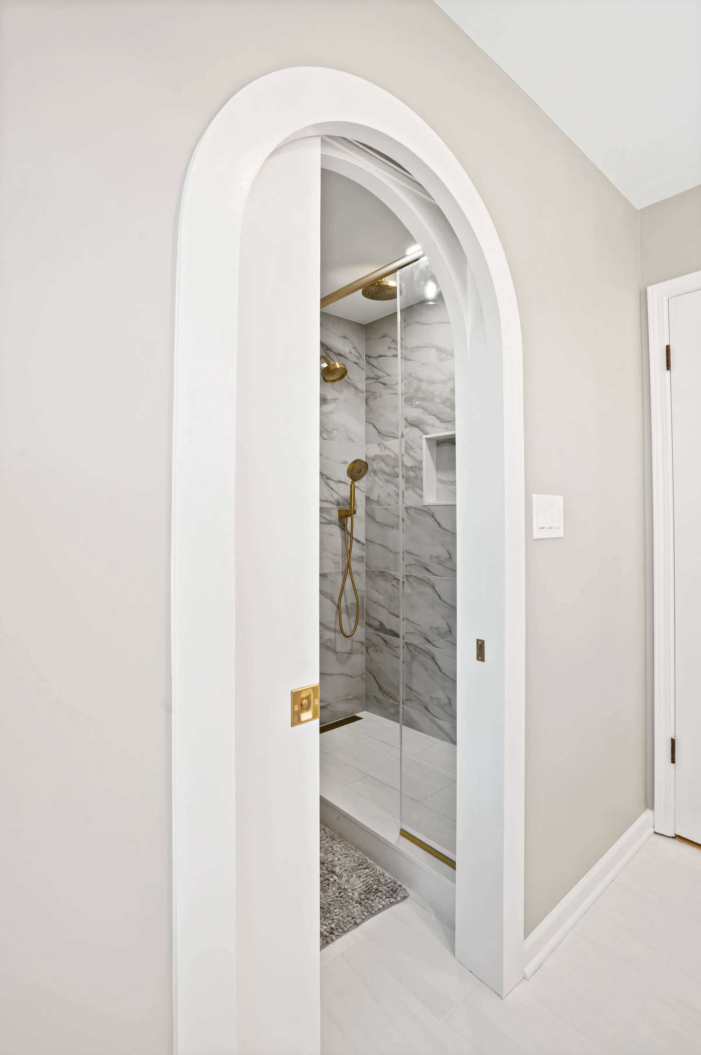 Lake Forest primary bathroom by Delta Remodels: finished interior overview