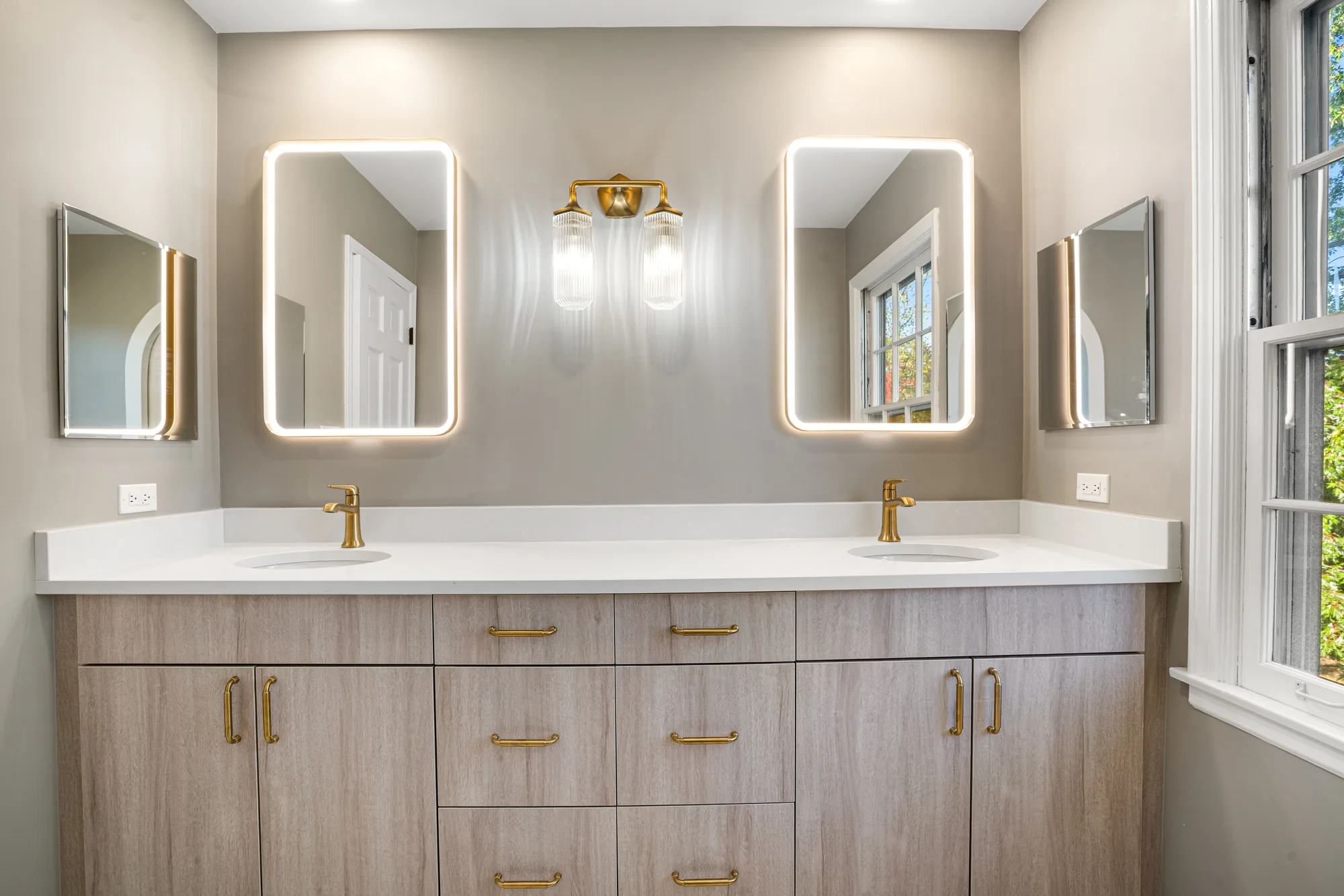 Wilson Road bathroom Lake Forest: archway opening to water closet with white oak-look plank flooring
